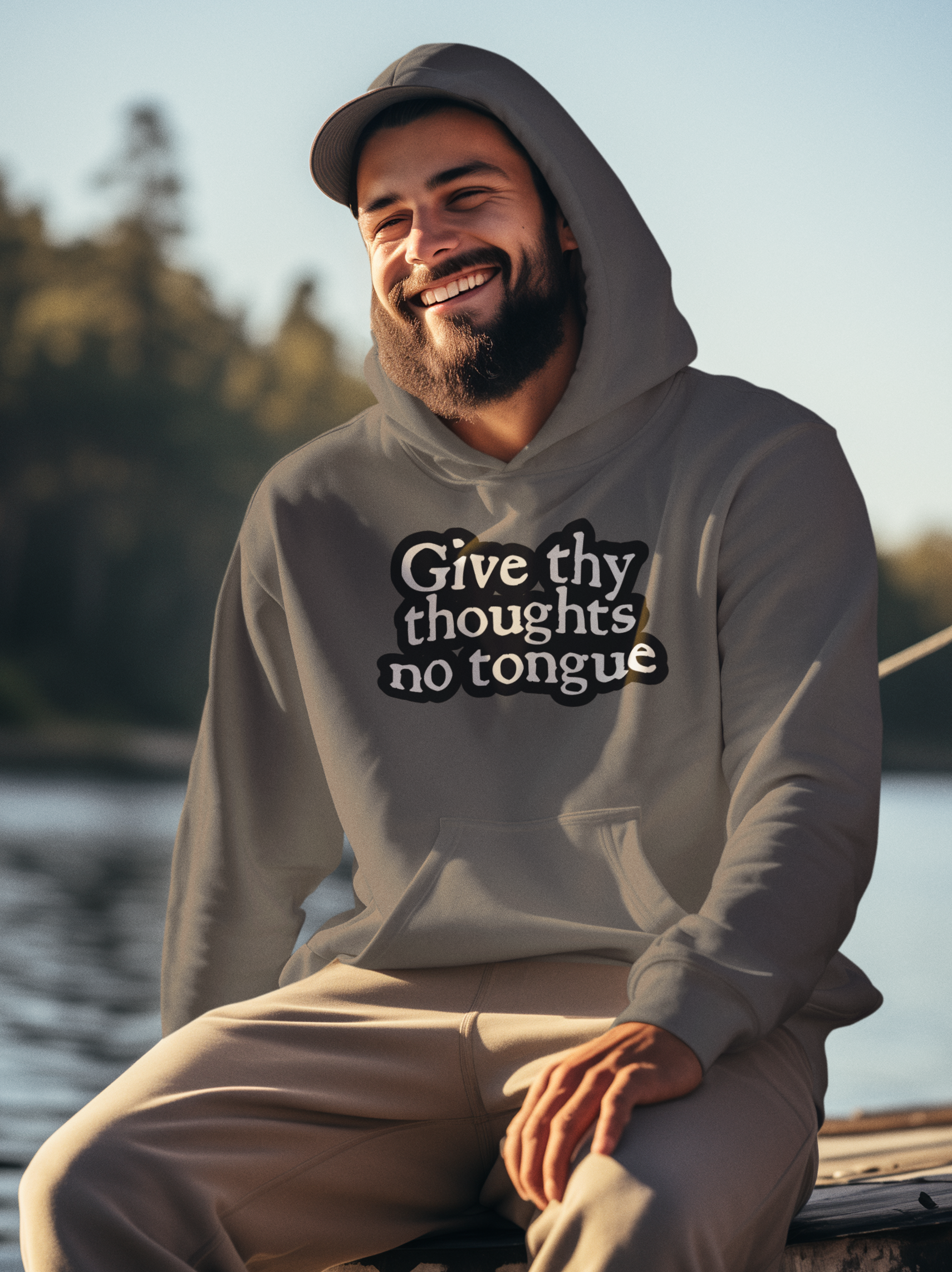Bearded man with a had and a grey Give Thy Thoughts No Tongue hoodie